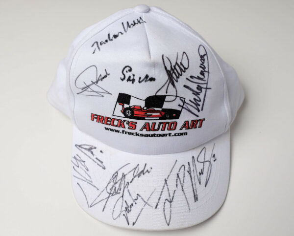 Freck’s Auto Art Cap Signed by Penske, Moss, Montoya, Fittipaldi + 7 more